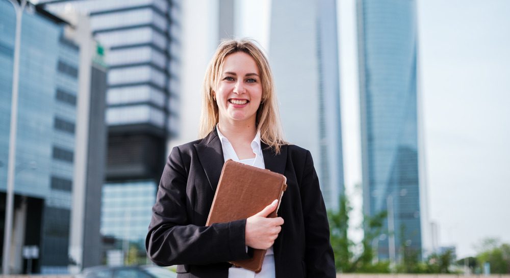 female worker infront of an office